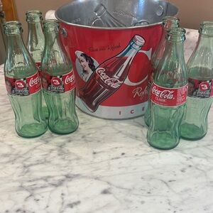 Coca-Cola Red and Green Bottles with Silver Bucket